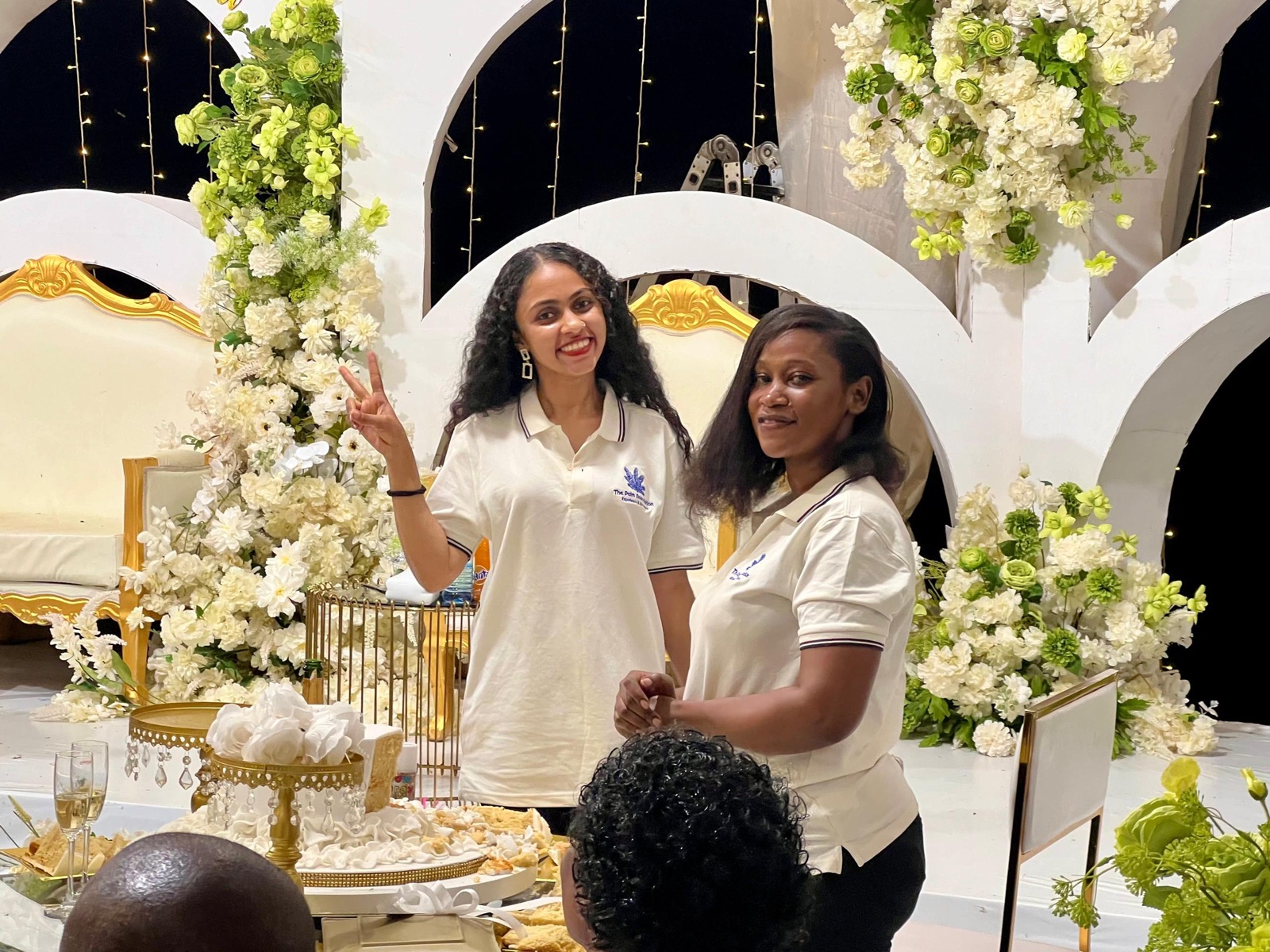 Two Palm Events team members at a decorated event setting